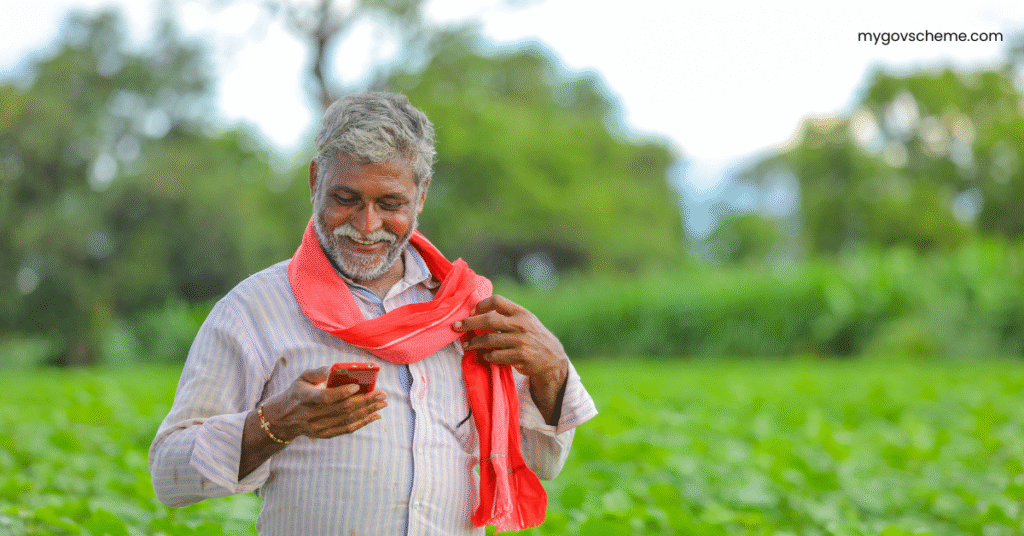 Indian farmer checking PM-KISAN status using mobile with Aadhaar card in hand